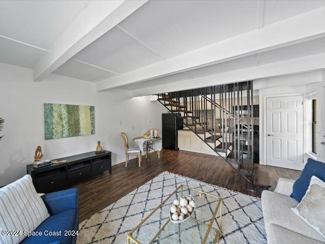 living room featuring hardwood / wood-style floors and beam ceiling