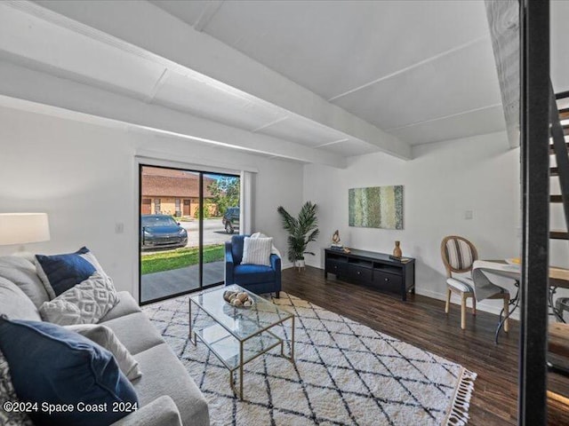 living room with hardwood / wood-style flooring and beam ceiling