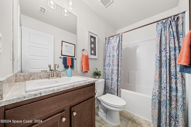 full bathroom featuring vanity, toilet, shower / bath combination with curtain, and a textured ceiling