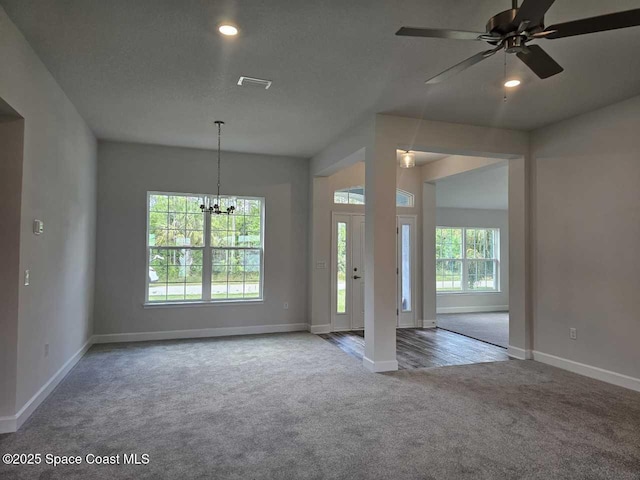 interior space featuring carpet flooring, baseboards, and visible vents