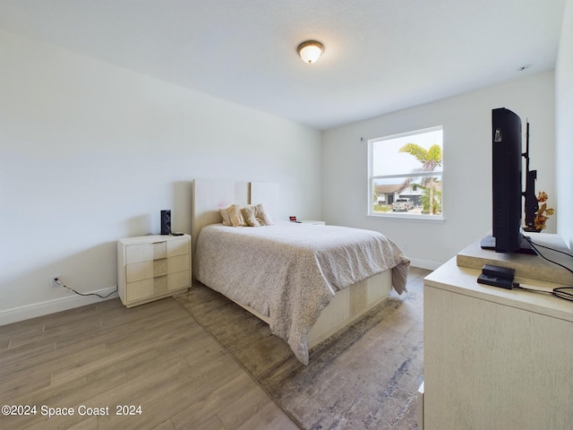 bedroom featuring hardwood / wood-style flooring