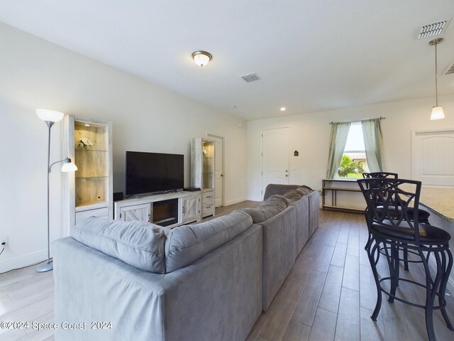 living room with light hardwood / wood-style flooring