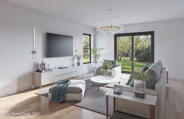 living room featuring light wood-type flooring and an inviting chandelier