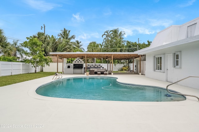 view of swimming pool featuring a patio