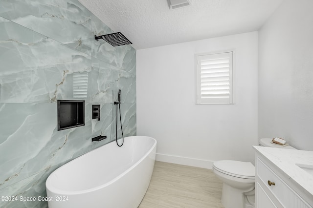 full bathroom featuring vanity, separate shower and tub, a textured ceiling, hardwood / wood-style flooring, and toilet