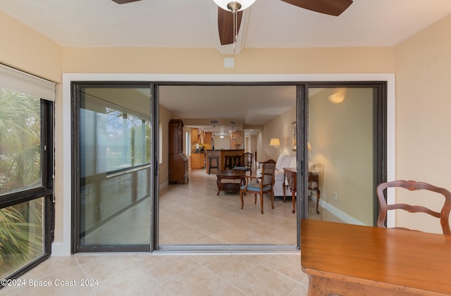 interior space with ceiling fan