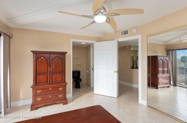 bedroom with ceiling fan, a closet, and light tile patterned flooring