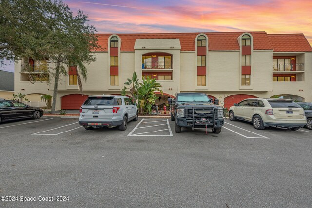 view of outdoor building at dusk