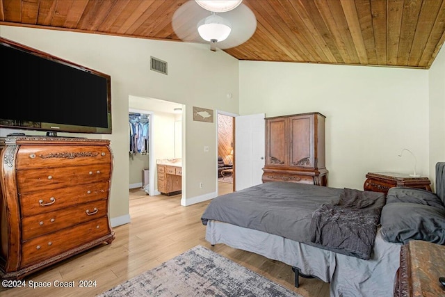 bedroom with light wood-type flooring, a closet, wooden ceiling, a spacious closet, and ensuite bathroom