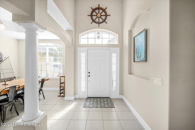 tiled foyer with ornate columns