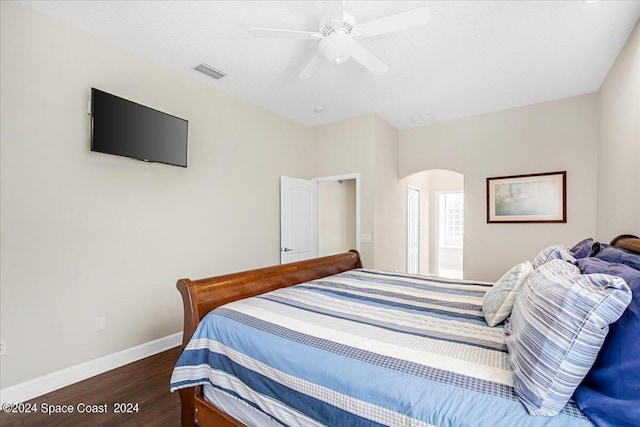 bedroom with ceiling fan and dark hardwood / wood-style flooring