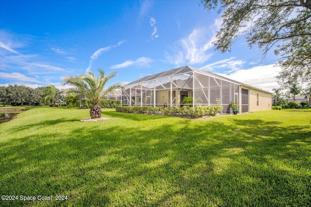 view of yard with glass enclosure