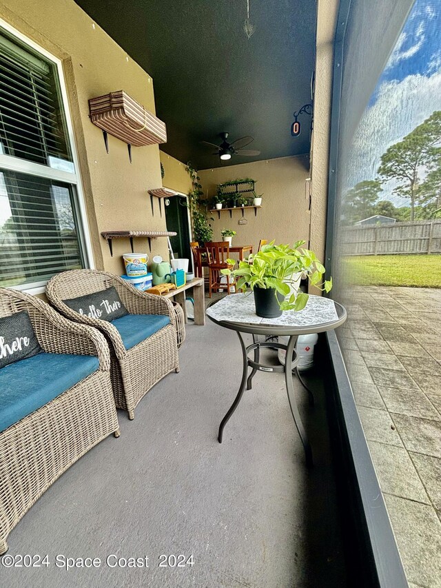 view of patio / terrace featuring ceiling fan