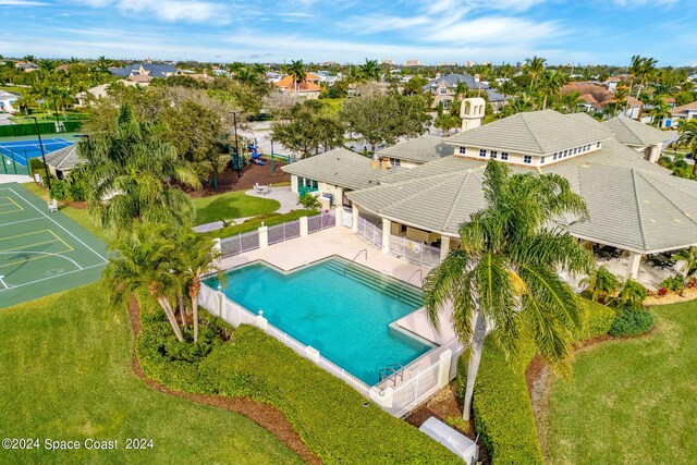 view of pool with a yard