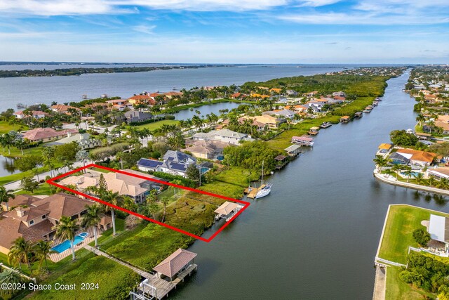 birds eye view of property featuring a water view