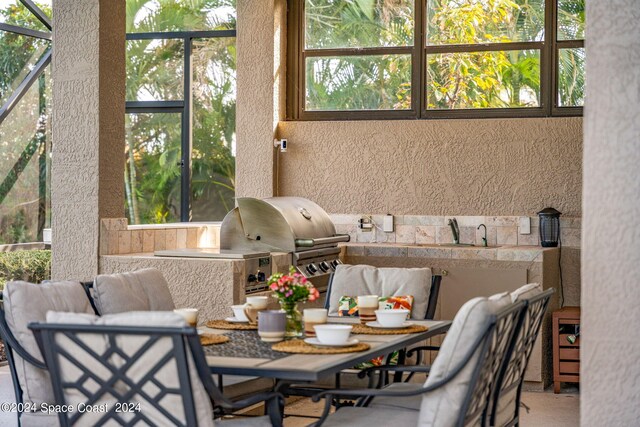 interior space with an outdoor kitchen and area for grilling