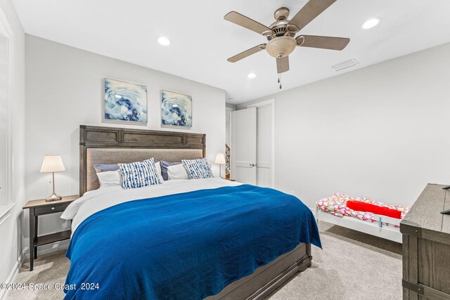 carpeted bedroom featuring ceiling fan