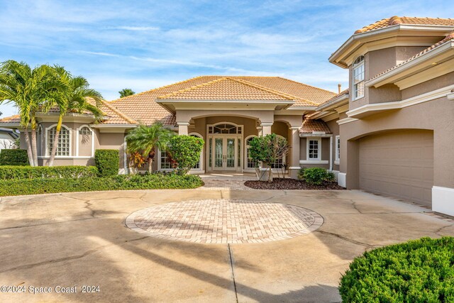 mediterranean / spanish-style home featuring french doors