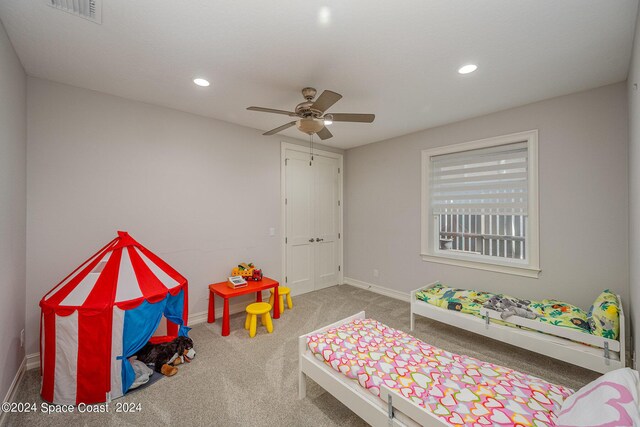 carpeted bedroom featuring ceiling fan