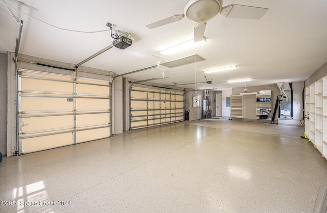 garage featuring ceiling fan and a garage door opener