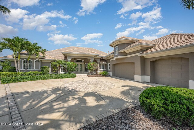 mediterranean / spanish house with a garage