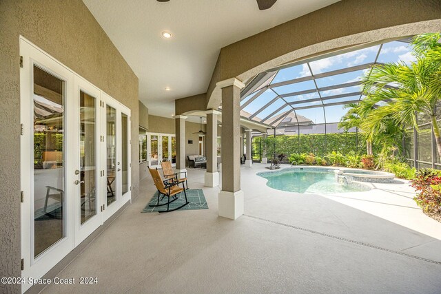 view of pool with french doors