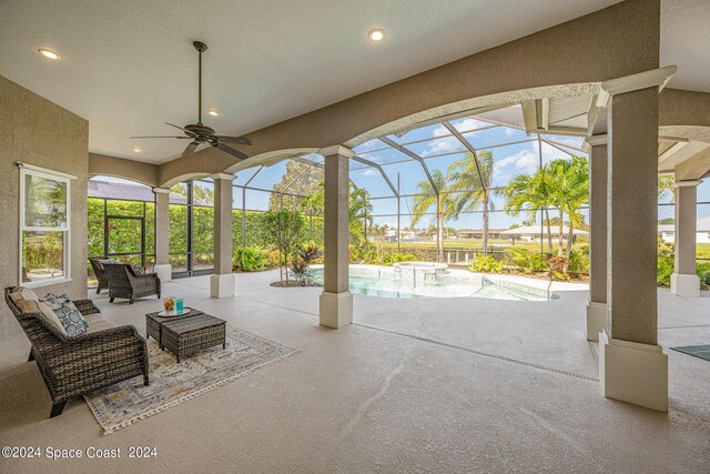 view of patio / terrace with glass enclosure and ceiling fan