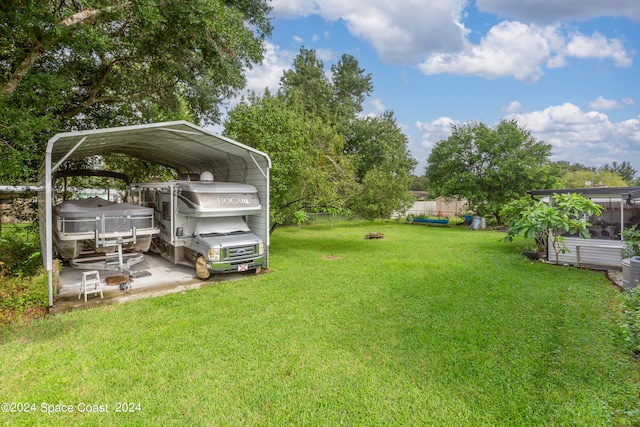 view of yard featuring a carport