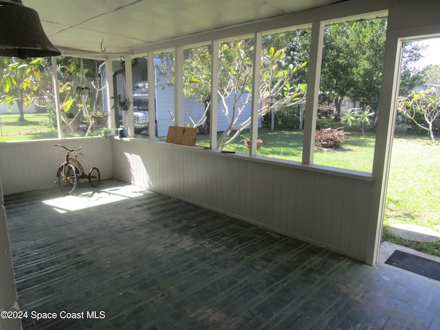 unfurnished sunroom with plenty of natural light