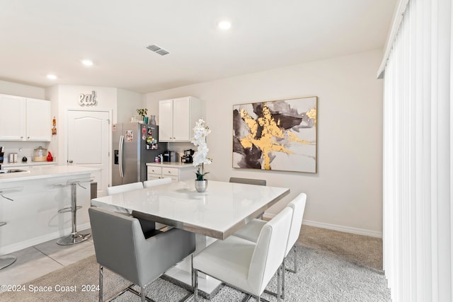 dining area featuring light tile patterned floors