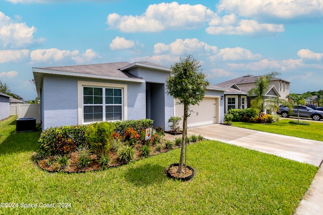 view of front of house featuring a front lawn and a garage