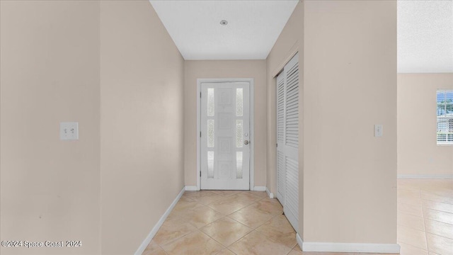 interior space featuring light tile patterned floors