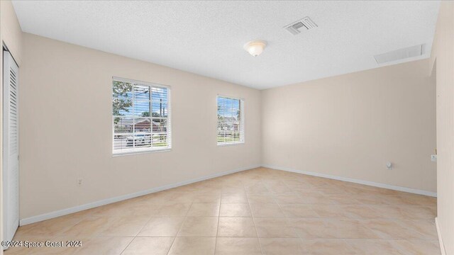 interior space featuring a textured ceiling