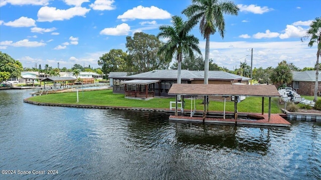 dock area with a yard and a water view