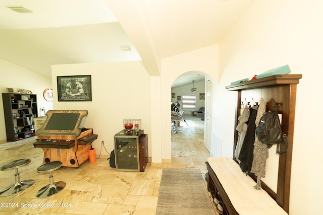 mudroom featuring lofted ceiling