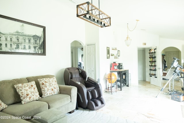 living room featuring a towering ceiling