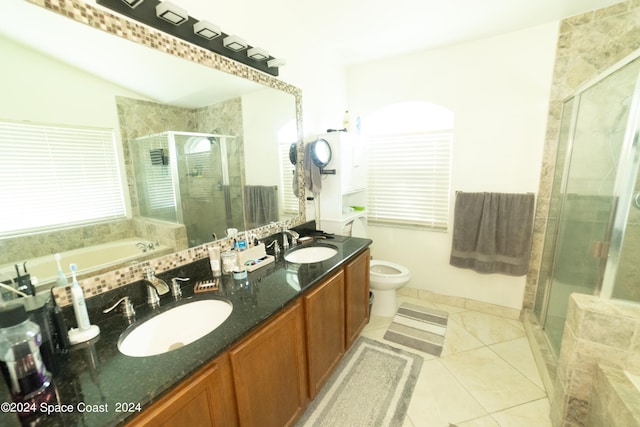 full bathroom featuring shower with separate bathtub, toilet, vanity, and tile patterned floors