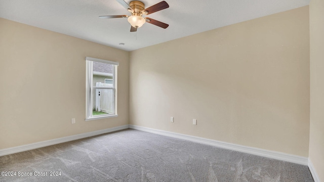 carpeted empty room with ceiling fan