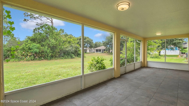 unfurnished sunroom featuring a wealth of natural light