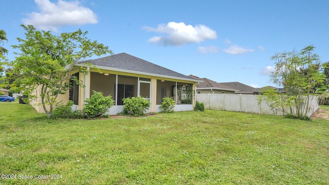 view of yard with a sunroom