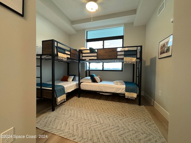 bedroom with hardwood / wood-style flooring and ceiling fan