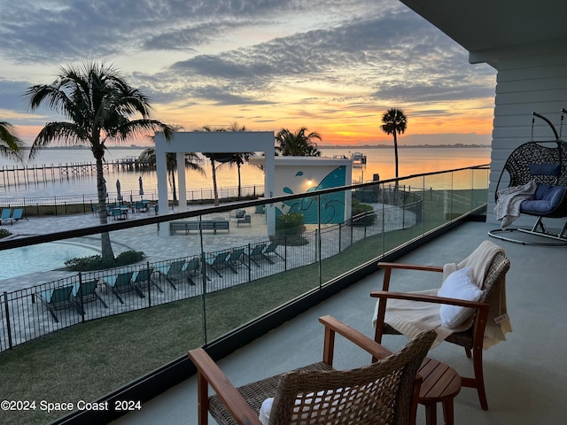 balcony at dusk with a water view