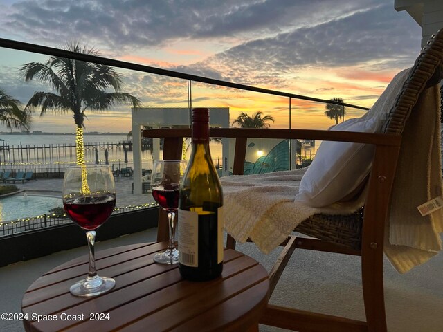 balcony at dusk with a water view