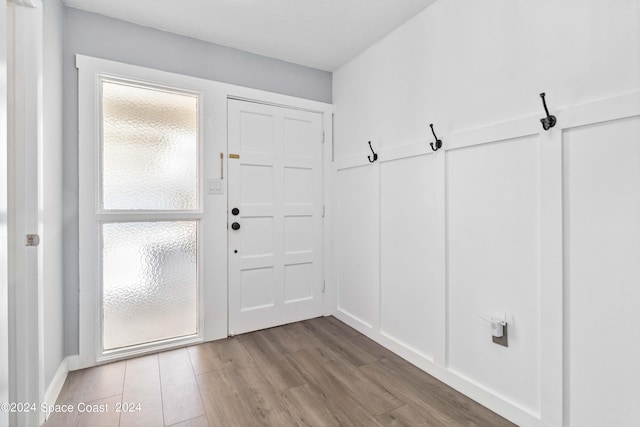 mudroom with wood-type flooring