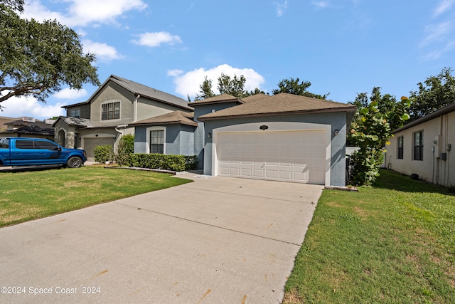 view of front of property featuring a garage and a front lawn