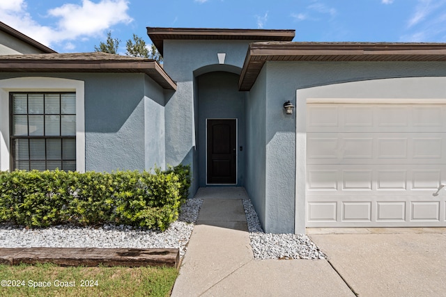 entrance to property featuring a garage