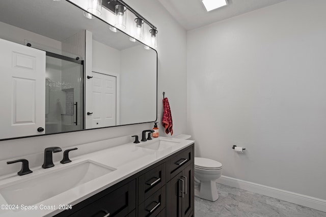 bathroom with toilet, a shower with door, and vanity