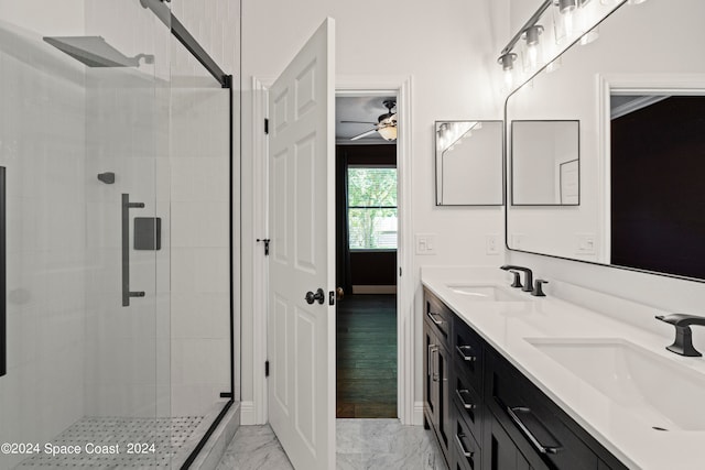 bathroom featuring vanity and a shower with shower door