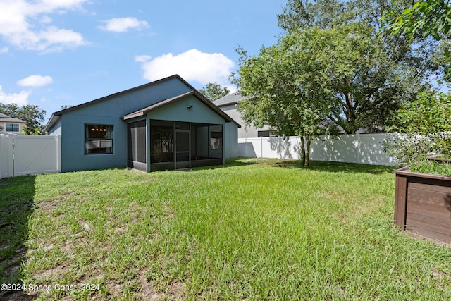 view of yard featuring a sunroom