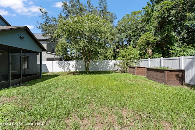 view of yard with a sunroom